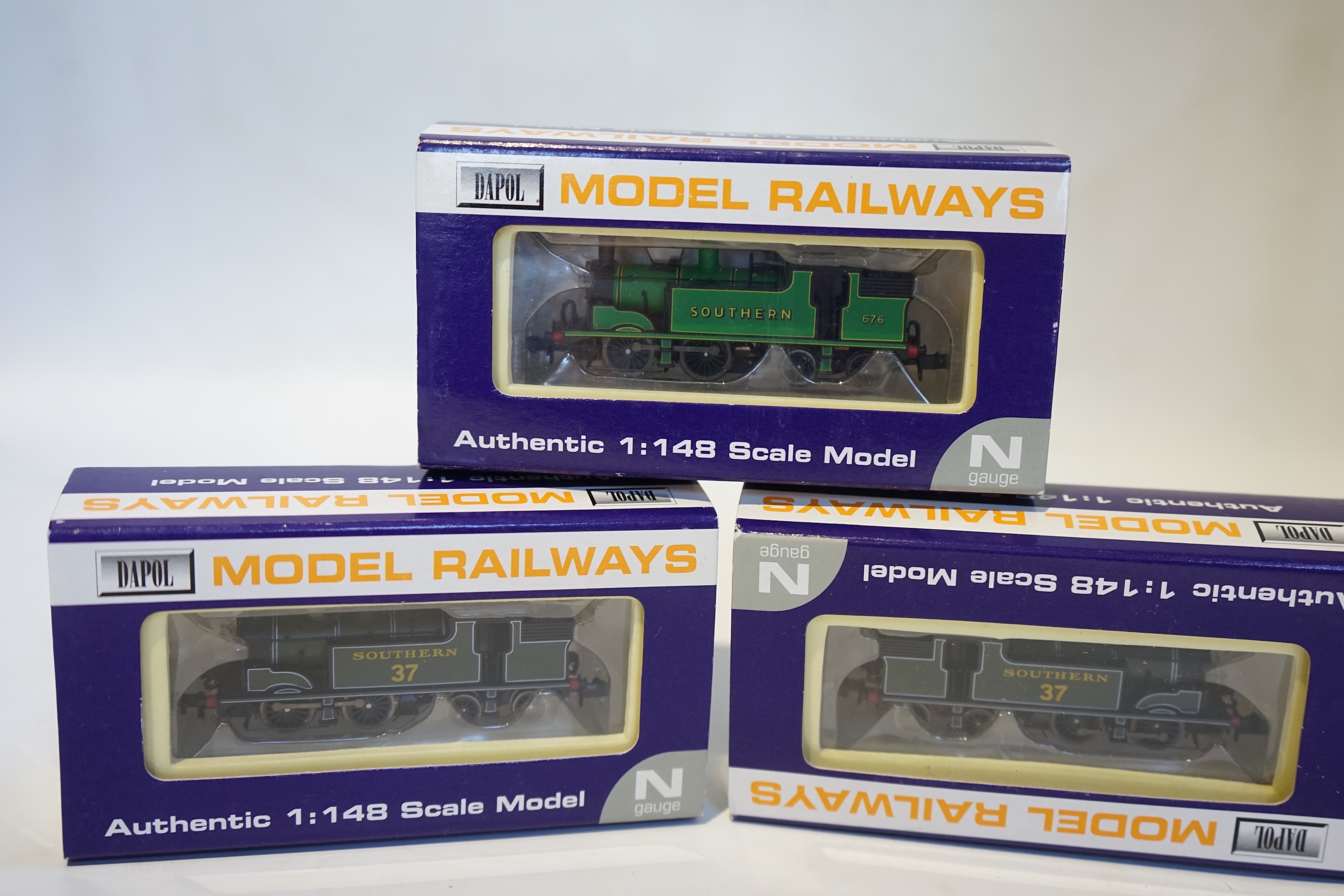 Three boxed Dapol N gauge railway Southern Railway locomotives; a Class M7, 37 (ND-26), a Class M7, 37 (ND-26), and a Class M7, 676 (ND-046). Condition - good.